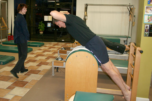 Pilates swan technique on the barrel